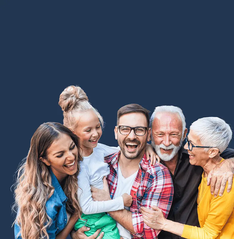 family smiling showing off dental implants and other cosmetic dentistry results.